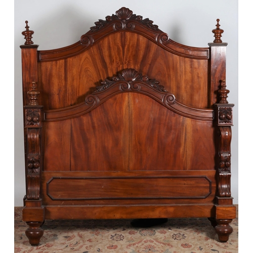 197 - A 19TH CENTURY CARVED MAHOGANY BED the rectangular arched headboard with foliate and shell cresting ... 