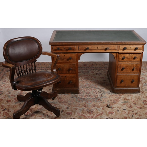 205 - A 19TH CENTURY OAK PEDESTAL DESK of rectangular outline the shaped top with tooled leather inset abo... 