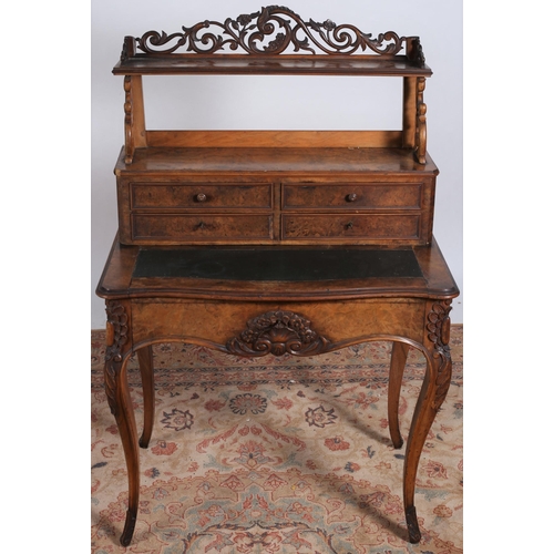 209 - A 19TH CENTURY WALNUT DESK the superstructure with open shelves above four short drawers with tooled... 