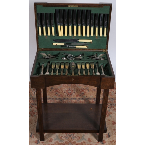 217 - AN OAK CASED CANTEEN OF CUTLERY comprising eight fish knives and forks, eight dinner knives, eight t... 