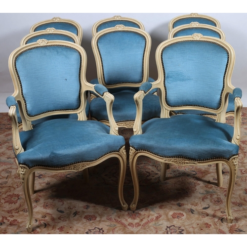 227 - A SET OF EIGHT CONTINENTAL CREAM PAINTED AND UPHOLSTERED  DINING CHAIRS including a pair of elbow ch... 