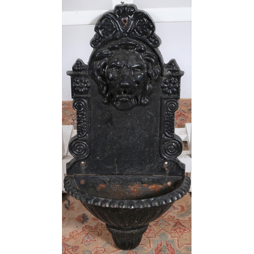 237 - A VICTORIAN DESIGN CAST IRON WALL MOUNTED FOUNTAIN the rectangular arched back plate with lion mask,... 