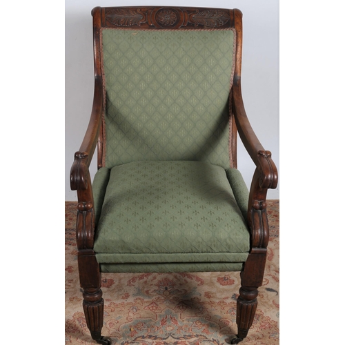 248 - A REGENCY CARVED MAHOGANY UPHOLSTERED ARMCHAIR the shaped top rail above an upholstered back and sea... 