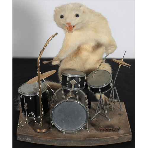 258 - AN AMUSING VINTAGE WHITE METAL AND BRASS BAND the drummer modelled as a stoat 25cm(h) x 22cm(w) x 15... 