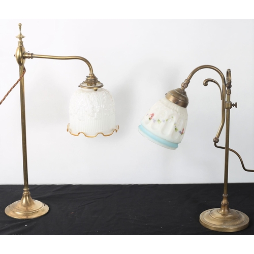 267 - TWO 19TH CENTURY BRASS DESK LAMPS each with adjustable arm with opaline glass shades raised on a cir... 