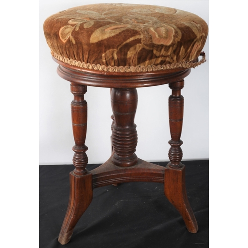 289 - A VINTAGE MAHOGANY REVOLVING STOOL the circular upholstered seat raised on turned supports with spla... 