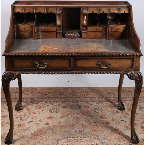 346 - A GEORGIAN DESIGN MAHOGANY CARLTON HOUSE DESK the rectangular top with moulded gallery above pigeon ... 