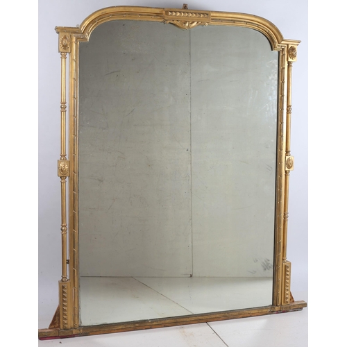 351 - A 19TH CENTURY GILTWOOD AND GESSO OVERMANTLE MIRROR the rectangular arched plate within a moulded fr... 