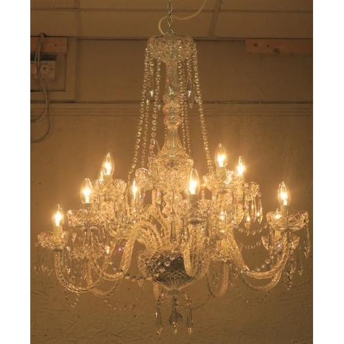 415 - A FINE TIPPERARY EIGHTEEN BRANCH CUT GLASS CHANDELIER in two registers hung with faceted chains and ... 