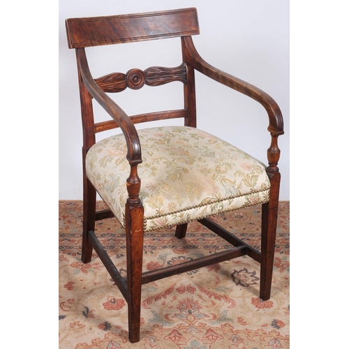 443 - A REGENCY DESIGN STAINED WOOD AND UPHOLSTERED ELBOW CHAIR the curved top rail above a carved splat w... 