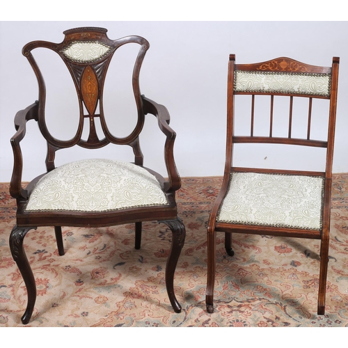 444 - AN EDWARDIAN MAHOGANY INLAID AND UPHOLSTERED ELBOW CHAIR the pierced shaped back above an upholstere... 