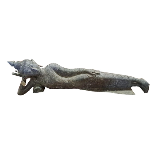 452 - A BRONZE LYING BUDDHA shown wearing an angle dress resting on her side with one arm supporting her h... 