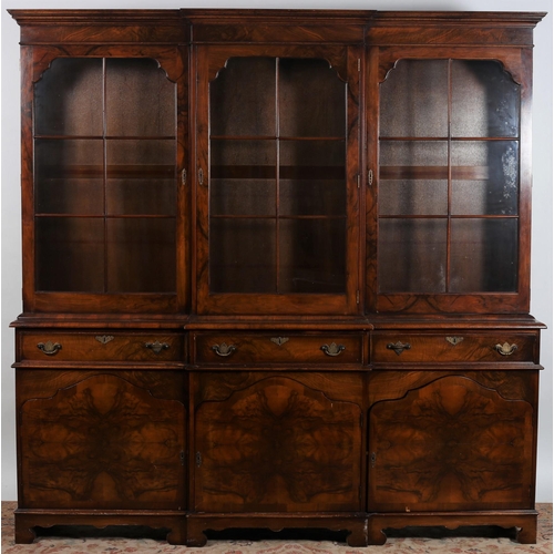 457 - A GEORGIAN DESIGN WALNUT AND MAHOGANY LIBRARY BOOKCASE of breakfront outline the moulded cornice abo... 