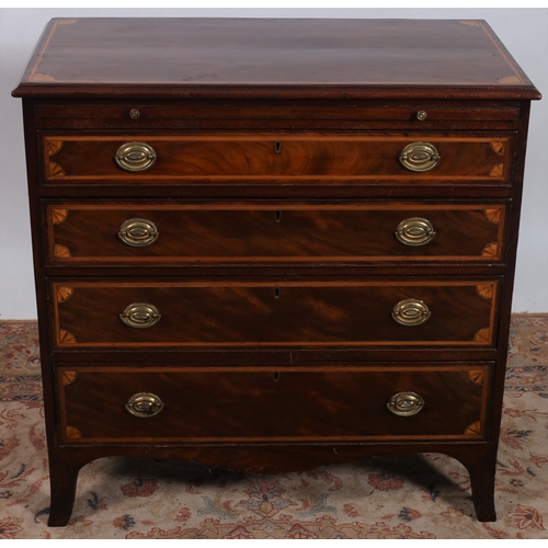 459 - A GEORGIAN MAHOGANY AND SATINWOOD INLAID CHEST of rectangular outline the shaped top above a brush a... 