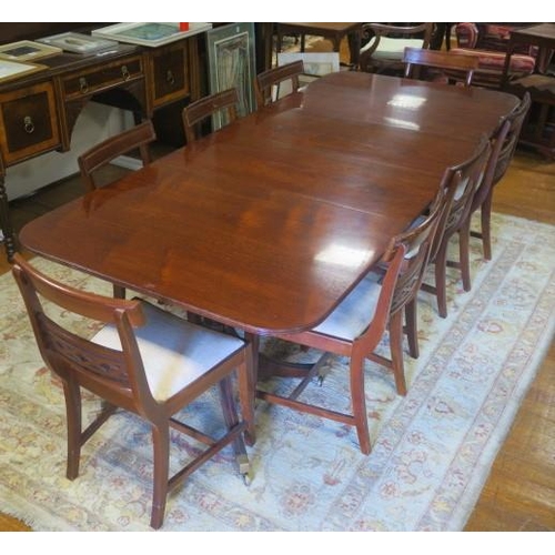 489 - A REGENCY MAHOGANY NINE PIECE DINING ROOM SUITE comprising eight chairs each with a curved top rail ... 