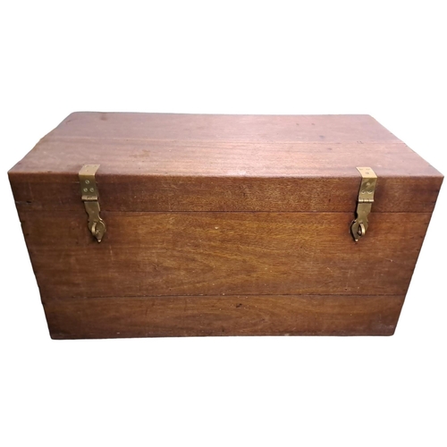 501 - A VINTAGE MAHOGANY TRUNK of rectangular outline the hinged lid with brass clasps containing a zinc l... 