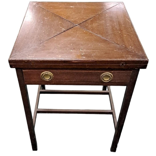 505 - AN EDWARD MAHOGANY ENVELOPE CARD TABLE the square moulded top with hinged leaves containing counter ... 