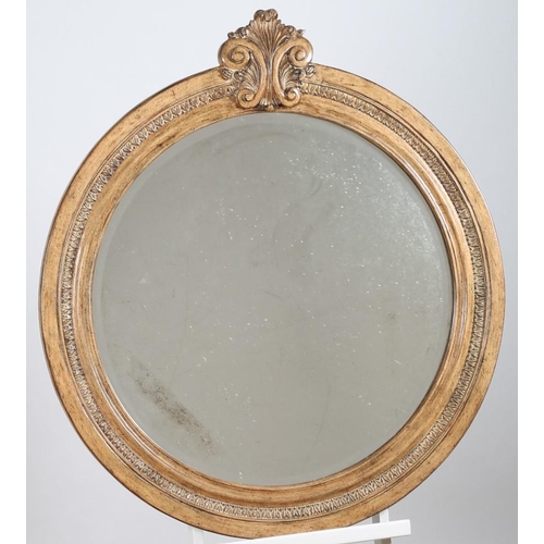 515 - A CONTINENTAL HARDWOOD FRAMED MIRROR the circular bevelled glass plate within an egg and dart moulde... 