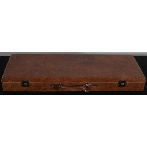 519 - A LEATHER BOUND TRAVELLING GUN CASE with brass clasps 
9cm (h) x 80cm (w) x 29cm (d