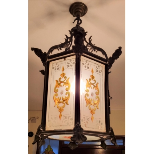 544 - A 19TH CENTURY WHITE METAL LANTERN of octagonal outline the frosted and coloured glass panels betwee... 