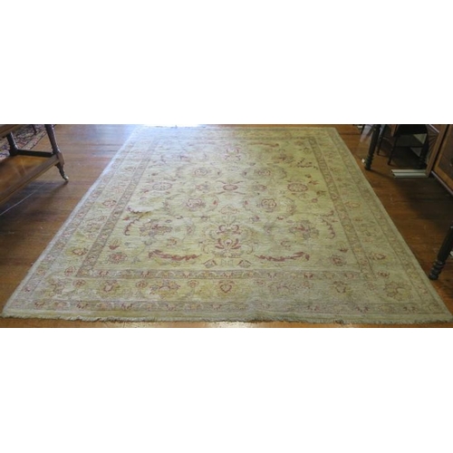 546 - A WOOL RUG the beige ground with central panel filled with stylised flowerheads and palmets within a... 