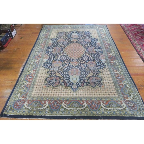 549 - AN ORIENTAL WOOL RUG the multicoloured ground with central panel filled with stylised flowerheads an... 