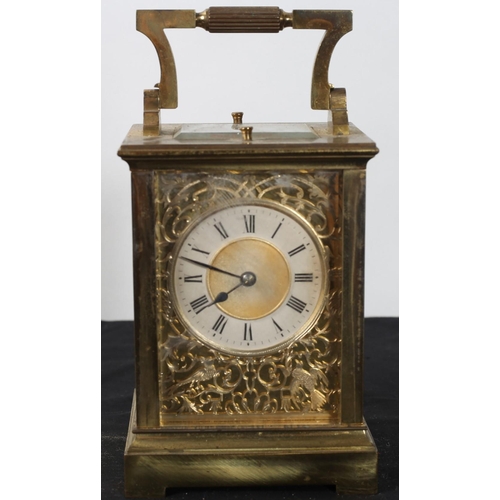 572 - A FRENCH BRASS REPEATER CARRIAGE CLOCK the rectangular case with carrying handle above a silvered di... 