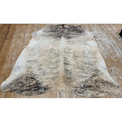 596 - AN AUTHENTIC NGUNI CATTLE HIDE from the Kwa-Zulu Natal Midlands in South Africa. Superior quality, e... 