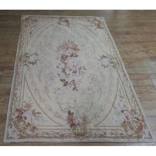 620 - A CONTINENTAL AUBUSSON WALL HANGING the beige ground with floral decoration 
180cm x 121cm