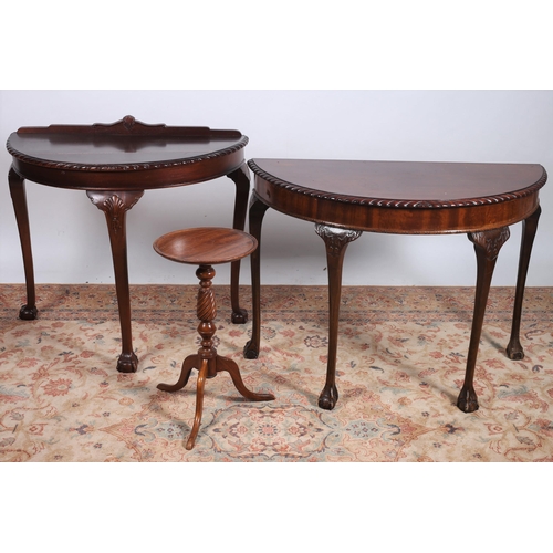 625 - TWO CHIPPENDALE DESIGN MAHOGANY SIDE TABLES each of demi lune outline the shaped tops with gadrooned... 