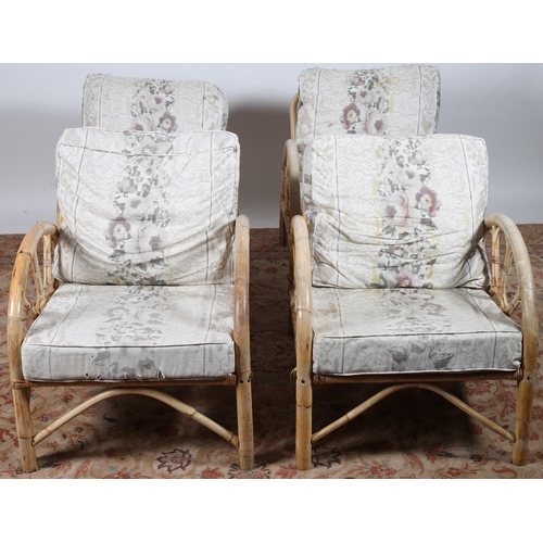 641 - A SET OF FOUR BAMBOO CONSERVATORY CHAIRS each with a rectangular back and shaped arms with loose cus... 