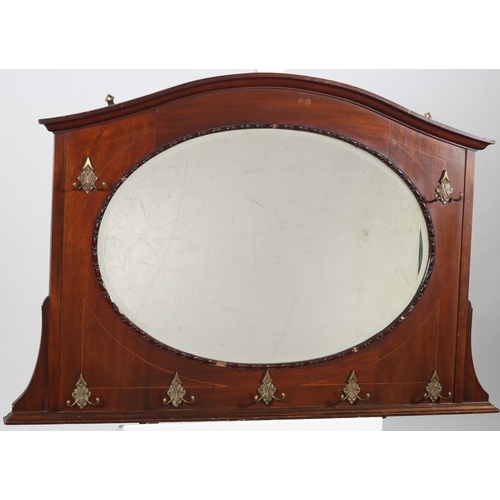 650 - A VINTAGE MAHOGANY AND SATINWOOD INLAID WALL MOUNTED MIRROR of rectangular form the bevelled glass p... 