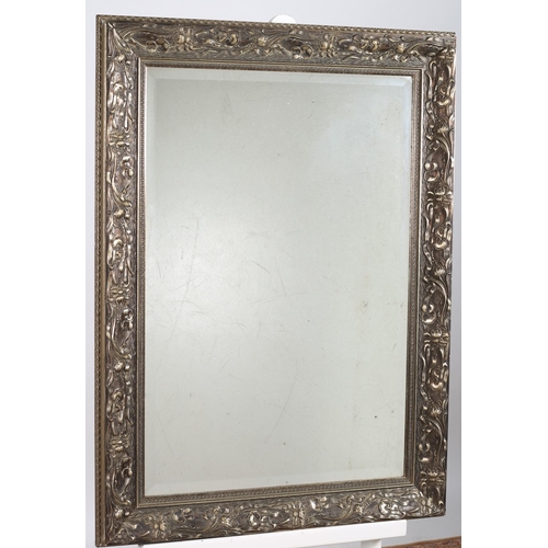 652 - AN EBONISED MIRROR the rectangular plate within a gilt border 
89cm (h) x 72cm (w)
A 19TH CENTURY GI... 