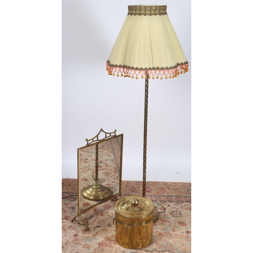 750 - A BRASS MIRRORED FIRESCREEN together with a brass spiral twist floor standard lamp with shade and a ... 