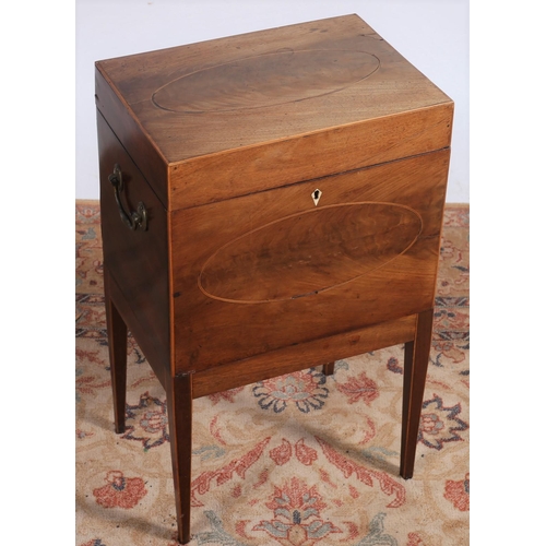 82 - A GEORGIAN MAHOGANY AND SATINWOOD INLAID CELLARETTE of rectangular outline the hinged lid with brass... 