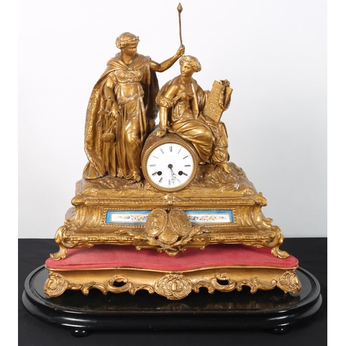 95 - A 19TH CENTURY FRENCH GILT AND PORCELAIN MANTLE CLOCK surmounted by figures the circular enamel dial... 