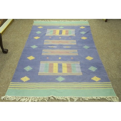 619 - A KILIM WOOL RUG the light blue and turquoise ground with central serrated panels within a conformin... 