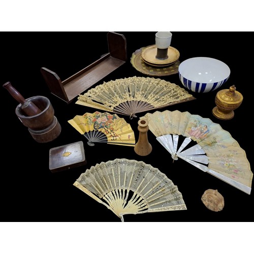 662 - A MISCELLANEOUS COLLECTION to include four folding hand fans, a hardwood mortar and pestle, a 19th C... 