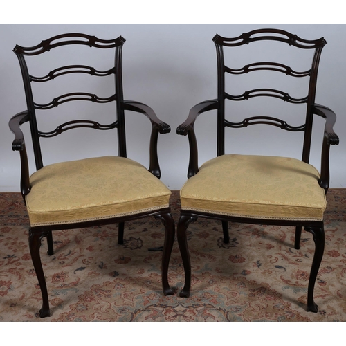 815 - A PAIR OF CHINESE CHIPPENDALE DESIGN CARVERS each with a pierced ladder back and upholstered seat wi... 