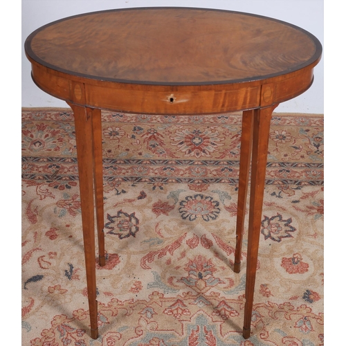 31 - A 19TH CENTURY SATINWOOD AND ROSEWOOD CROSSBANDED OCCASIONAL TABLE the oval hinged top on square tap... 