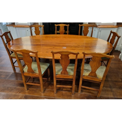 60 - A NINE PIECE OAK AND PINE DINING ROOM SUITE comprising eight chairs each with a shaped top rail and ... 