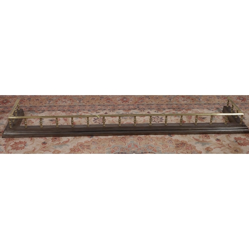 749 - A 19TH CENTURY BRASS AND POLISHED STEEL FENDER the shaped top rail above a stepped platform joined b... 