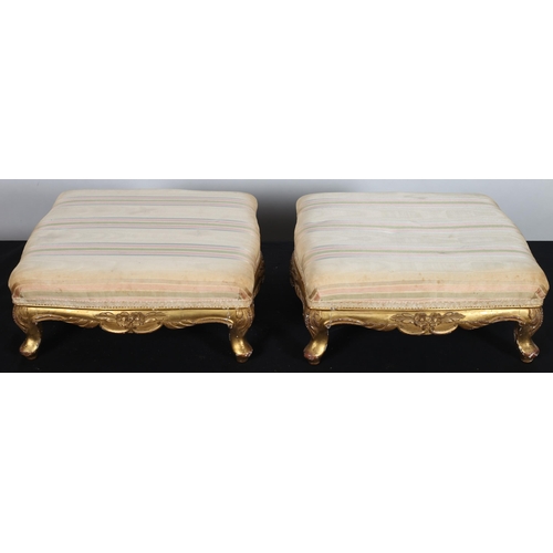 103 - A PAIR OF 19TH CENTURY CONTINENTAL CARVED GILTWOOD AND UPHOLSTERED STOOLS each of square outline on ... 