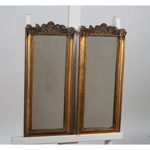 151 - A PAIR OF CONTINENTAL GILT FRAME MIRRORS each with a rectangular plate within a moulded frame with f... 