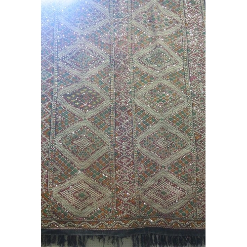 558 - A 1960s AFGHAN WOLLY KILN MULTICOLOURED GROUND PATTERN RUG WITH SEQUINS   
440cm (l) x 170cm (w)