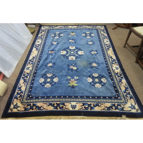 559 - A CHINESE PEKING WOOL RUG c.1940s the blue and beige ground with central panel filled with stylised ... 