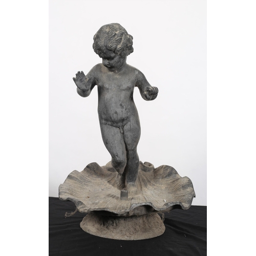 562 - A LEAD FOUNTAIN modelled as a young boy shown standing on a shell shaped dish 
53cm (h) x 35cm (w)