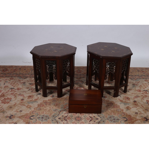 706 - A PAIR OF ORIENTAL ROSEWOOD AND BRASS INLAID OCTAGONAL SHAPED TABLES on folding stands
45cm (h) x 46... 