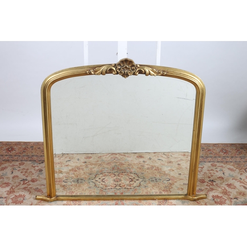 713 - TWO VICTORIAN DESIGN GILT FRAME OVERMANTLE MIRRORS each of rectangular arched outline the shaped pla... 