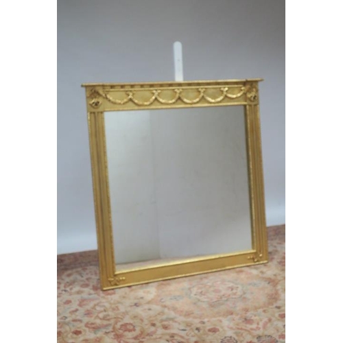 721 - A REGENCY DESIGN GILT FRAME OVERMANTLE MIRROR the rectangular plate within a roped and moulded frame... 